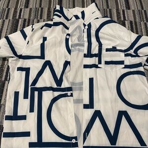 Simple button up t-shirt. Gently worn.